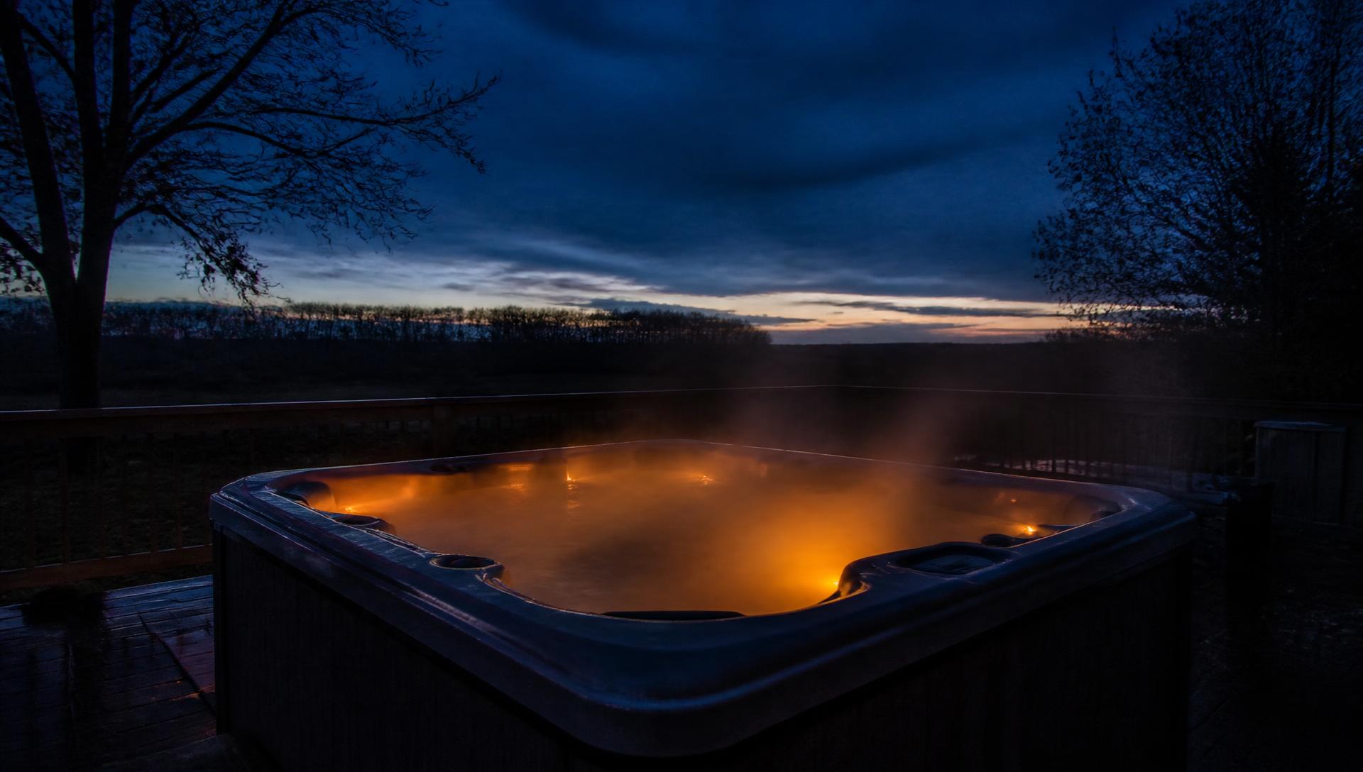 Hot tub steaming on a deck on a cool September evening in Saskatchewan